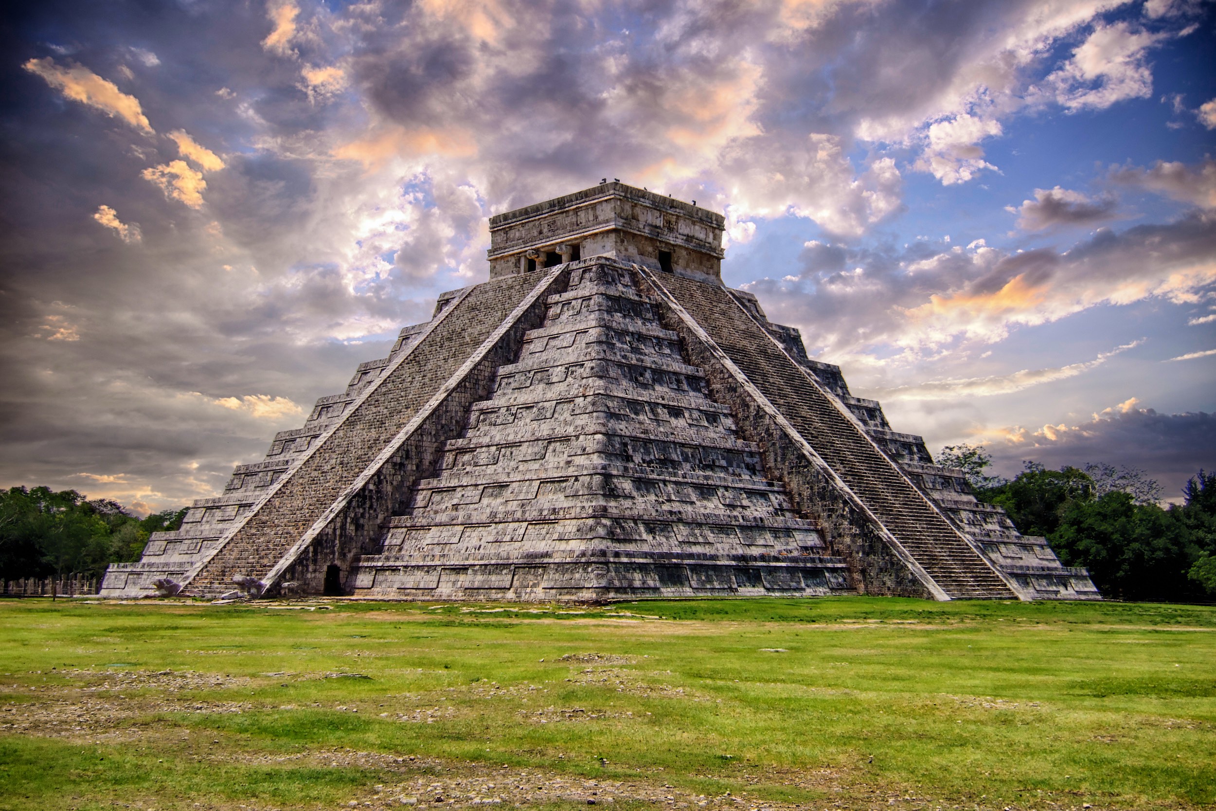 Cloudy blue sky over grassy land